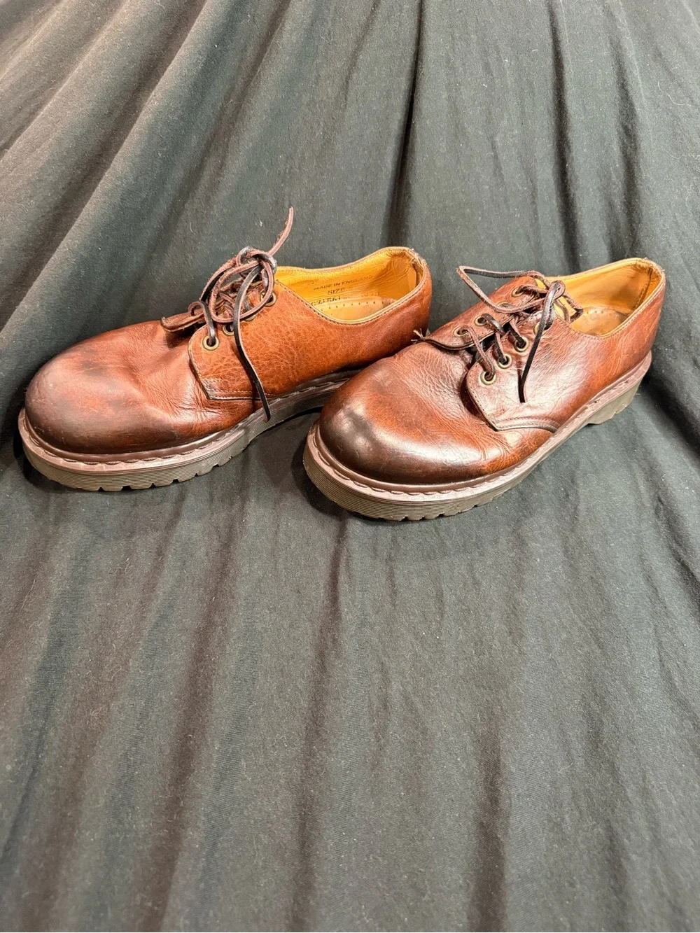 Vintage Dr. Martens Made in England (MIE) brown leather shoes.